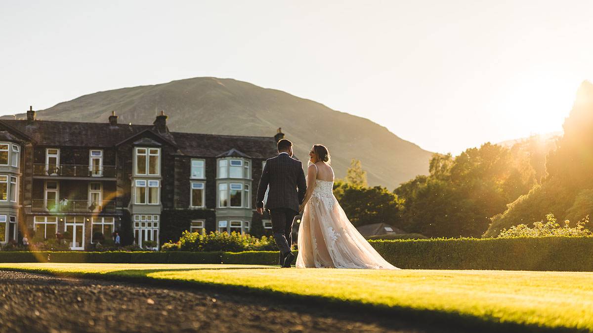 couple walking in the evening sunset - inn on the lake wedding photography couple walking in the evening sunset - inn on the lake wedding photography